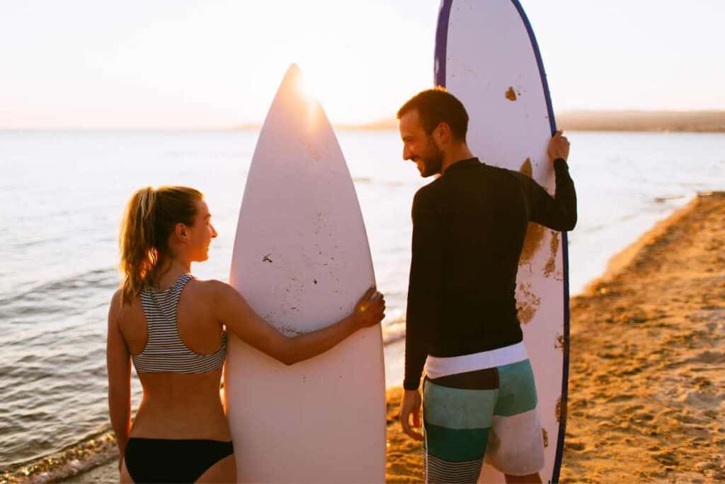 What are some tips for teaching someone to surf?